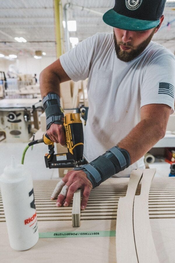 Hoodsly tech assembling a range hood